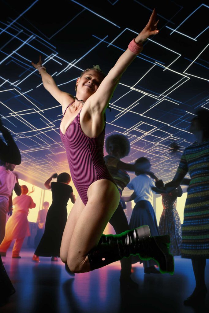 Sharni mid-dance, arms raised, joyful — Lady Bunya